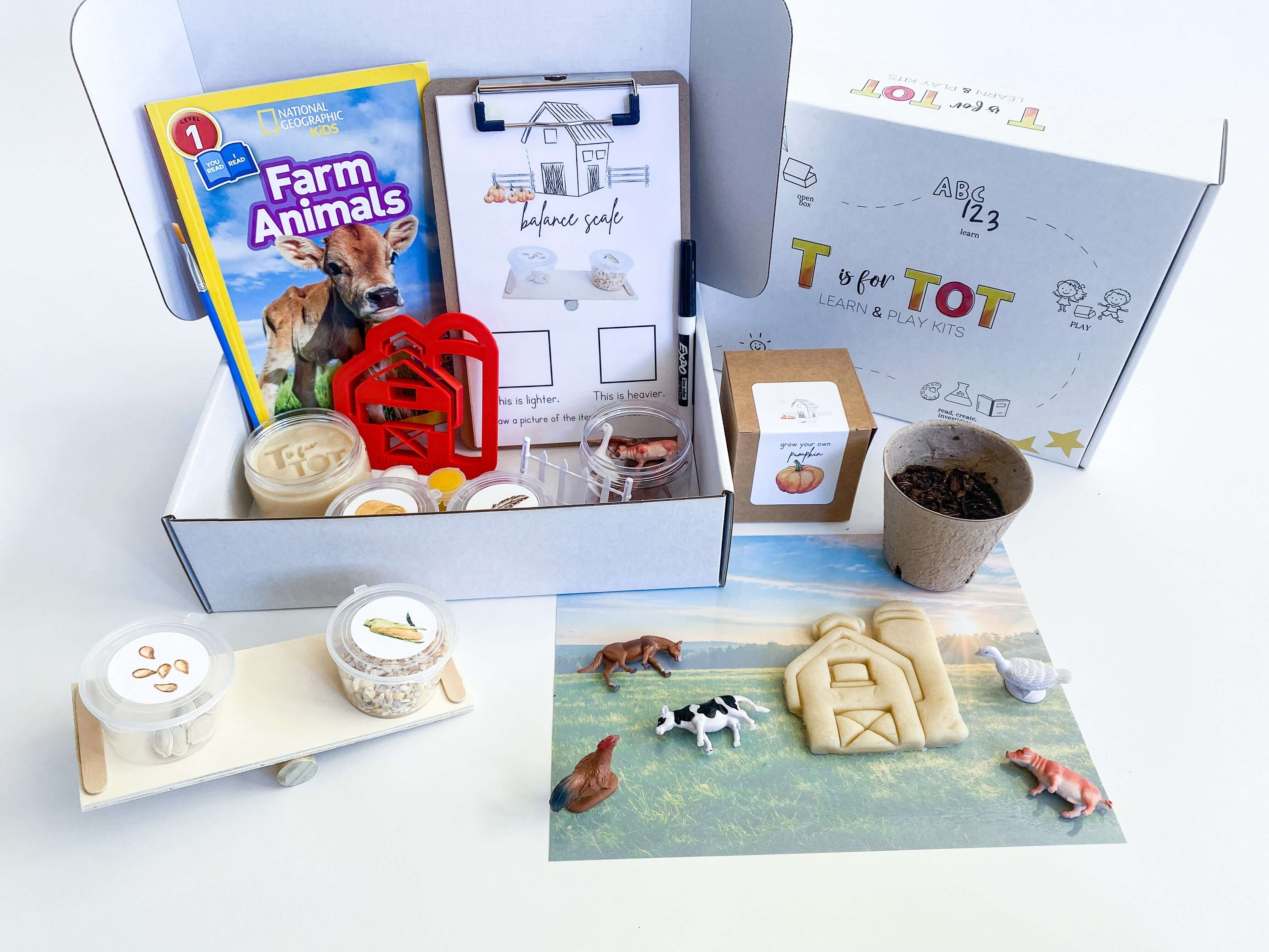 On the Farm play kit for kids with homemade non-toxic playdough and barn playdough cutter. Includes a playdough farm mat, farm animals with a fence, and a balance scale with farm items to weigh. Features a Grow Your Own Pumpkin kit, 